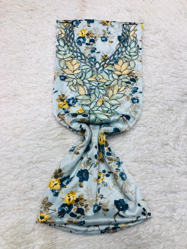 Light blue Moroccan embroidered fabric with tropical floral pattern and oversized beige-blue floral embroidery