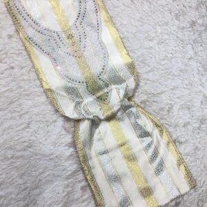 Luxury gold and silver striped fabric with floral beaded embroidery on soft textured background