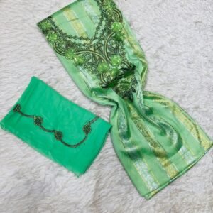 Green Moroccan fabric set with black floral designs, gold stripes, and central ornamental embroidery